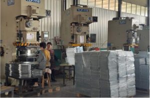 Row of stamping presses producing custom stainless steel parts