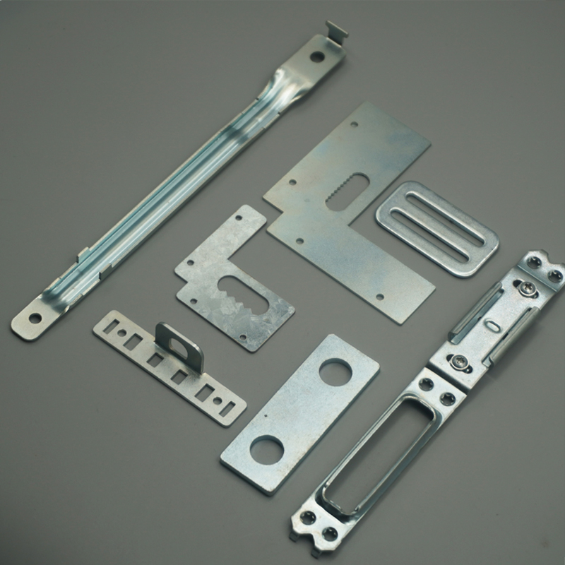 Seven galvanized steel hardware components including rail brackets, slotted mounting plates and a spring-loaded latch assembly